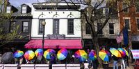 Volunteers, some with the Rainbow Defense Coalition, use umbrellas to block anti-trans protesters' views of Crazy Aunt Helen's Restaurant, which was hosting a Drag Story Hour event, in Washington, DC, USA, 08 April 2023. Anti-LGBTQ protestors have recently targeted Drag Story Hours, during which a drag performer reads stories to children and adults.  EPA-EFE/JIM LO SCALZO