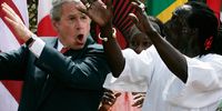 US President George W. Bush (L) dances with Artistic Dance Director Assane Konte (R) of Kankouran West African Dance Company during a Rose Garden event to mark the Malaria Awareness Day at the White House April 25, 2007 in Washington, DC. Bush has laid out his plans on combating malaria on the very first Malaria Awareness Day.  (Photo by Alex Wong/Getty Images)
