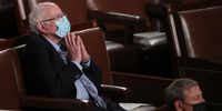 WASHINGTON, DC - APRIL 28: Senator Bernie Sanders (D-VT) watches as U.S. President Joe Biden addresses a joint session of Congress in the House chamber of the U.S. Capitol on April 28, 2021 in Washington, DC. On the eve of his 100th day in office, Biden spoke about his plan to revive America's economy and health as it continues to recover from a devastating pandemic. He delivered his speech before 200 invited lawmakers and other government officials instead of the normal 1600 guests because of the ongoing COVID-19 pandemic. (Photo by Michael Reynolds - POOL/Getty Images)