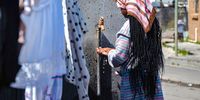 The communal tap outside Analise Mgedezi’s house in Khayelitsha (Cape Town). The family shares this tap, situated to communal toilets, with 55 other families.<br>(Photo: Newton Stanford)