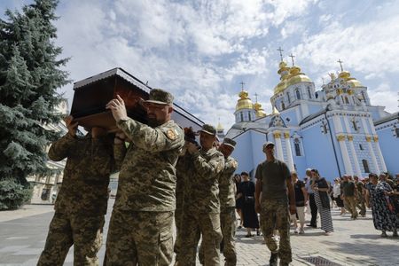 Russian drones bear down on Ukrainian capital, up to three injured