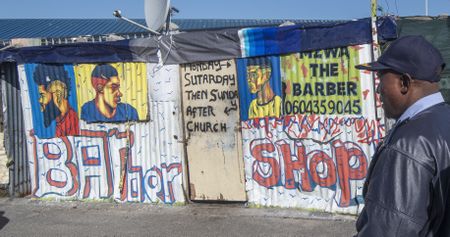 Fear stalks Cape Town community as pair linked to barber shop killing of three kids and a man appear in court