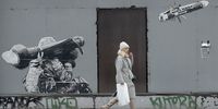 epaselect epa10424754 A woman walks past a graffiti on a wall depicting a Ukrainian soldier launching an anti-tank missile with a banner reading 'Just one target' in downtown Kiyv (Kiev), Ukraine, 23 January 2023, amid Russia's invasion. Russian troops entered Ukraine on 24 February resulting in fighting and destruction in the country and triggering a series of severe economic sanctions on Russia by Western countries.  EPA-EFE/SERGEY DOLZHENKO