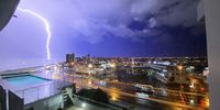 Heaven taking pics ……lightening strike brightens the wintery skies over Blouberg. Photographer: Mark Cromhout