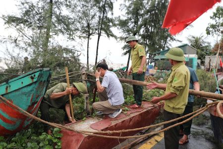 Trees down, homes flooded as Typhoon Kajiki batters Vietnam