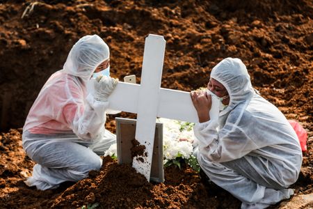 Almost three times as many died as a result of Covid-19 than officially reported
