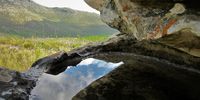 Sliver of sky reflected in rain fed rock pool. Photographer: Anne Rogers