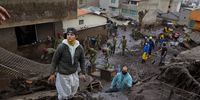 Rescue workers and local residents remove debris following a mudslide in Quito, Ecuador, on Tuesday, Feb. 1, 2022. A mudslide that tore down a steep neighborhood in north-central Quito, Ecuadors capital, left at least 14 dead and 32 injured and the area without electricity, the government emergency response office Riesgos Ecuador said. Photographer: Karen Toro/Bloomberg via Getty Images