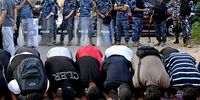 Activists pray during a protest in solidarity with the Palestinian people and to condemn the Israeli airstrikes in the southern Gaza Strip city of Rafah, organised by 'Students against the Occupation' under the slogan 'The Egyptian regime is a partner in genocide', outside the Egyptian embassy in Beirut, Lebanon, on 27 May 2024. (Photo: EPA-EFE / Wael Hamzeh)