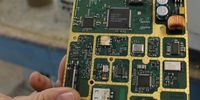 Apart from hazardous metals and chemicals, e-waste can also contain commercially valuable resources — such as the gold-plating on this printed circuit-board. (Photo: Tony Carnie)