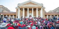 Students, staff and members of the LGBTQIA+ community  protest against homophobia at UCT Plaza before a public lecture by Kenyan professor Patrick Lumumba. (Photo: Gallo Images / ER Lombard)