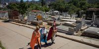 epa09670892 Men dressed as Three Wise Men walk along a path inside the General South Cemetery, in Caracas, Venezuela, 06 January 2021.The three Magi walked together with a group of volunteers, and brought joy and gifts to more than 80 children through part of the Barrio Nuevo, a community in western Caracas.  EPA-EFE/Rayner Pena R.