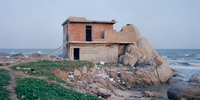 'A Home That is Changing'. Seaside house. <br>Zhanjiang, China, 2022. China is one of the fastest growing and fastest changing countries in the world. Like all countries, it also faces the consequences of global warming and environmental change: we live on the same planet and share a future. I hope that these photographs encourage people to think about the relationship between human development and a harmonious coexistence with the natural environment. Image: © liang chen, China Mainland, Shortlist, Professional competition, Landscape, Sony World Photography Awards 2024