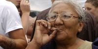 An older woman smokes a marijuana joint at Hempfest on August 21, 2004 in Seattle, Washington. More than 150,000 people were expected to attend Hempfest at Seattle's Myrtle Edwards Park on Seattle's waterfront on August 21-22, 2004. The event is billed as the world's largest drug-policy reform rally. Events included political speakers and dozens of bands and performers on six stages and over 20 organizations were present registering new voters. (Photo by Ron Wurzer/Getty Images)