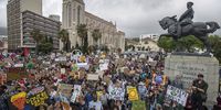epa07856197 Protesters take part in the Global Climate Strike as they march to parliament in Cape Town, South Africa, 20 September 2019. Thousands of children across South Africa joined the global call to action and climate strike protesting in Cape Town calling on government to make radical change in tackling climate change as millions of people around the world are taking part in protests demanding action on climate issues.  EPA-EFE/NIC BOTHMA