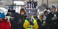 Protesters and mourners at a makeshift memorial for Alex Pretti in Minneapolis on 25 January. (Photo: Craig Lassig /EPA)<br>
