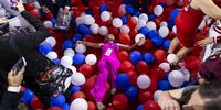 A woman lies in balloons on the floor at the end of the Republican National Convention (RNC) at Fiserv Forum in Milwaukee, Wisconsin, USA, 19 July 2024. The convention comes days after a 20-year-old Pennsylvania man attempted to assassinate former president and current Republican presidential nominee Donald Trump. The 2024 Republican National Convention is being held from 15 to 18 July, in which delegates of the United States' Republican Party select the party's nominees for president and vice president in the 2024 United States presidential election.  EPA-EFE/JUSTIN LANE  EPA-EFE/JUSTIN LANE