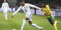 French superstar Kylian Mbappe beats Bafana's Mothobi Mvala during an international friendly at Stade Pierre Mauroy on March 29, 2022 in Villeneuve d'Ascq near Lille, France. (Photo by Jean Catuffe/Getty Images)