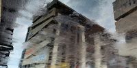 Tar Road Mirror - Our office block after the rain. Image: Marlene Birkholtz 