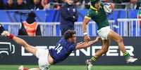 Springbok Cheslin Kolbe breaks through the tackle of Damian Penaud of France to score his team’s third try in the quarterfinal of the 2023 Rugby World Cup at Stade de France. (Photo: Warren Little / Getty Images)
