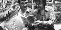 Nick Landau (right), co-founder of the original Forbidden Planet bookstore, with British author Douglas Adams. (Photo: Colin Davey / Evening Standard / Getty Images)
