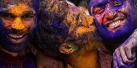 Revelers with color powder-stained faces attend a Holi festival celebration in Mumbai, India, 07 March 2023. Holi, also known as the Festival of Colors, is an ancient Hindu festival symbolizing the victory of good over evil and marking the arrival of spring. It is observed with joyful gatherings during which revelers cover each other in colored powders.  EPA-EFE/DIVYAKANT SOLANKI 9288