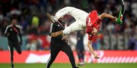 AL RAYYAN, QATAR - NOVEMBER 30:  A pitch invader temporarily avoids security during the FIFA World Cup Qatar 2022 Group D match between Tunisia and France at Education City Stadium on November 30, 2022 in Al Rayyan, Qatar. (Photo by Clive Mason/Getty Images)