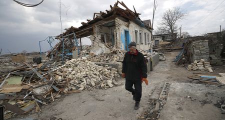 Macron presses Putin for humanitarian corridor; Moscow says it will reduce military operations