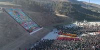 epa10445916 An aerial view of the 'sunning of the Buddha' ceremony at the Labrang Monastery in Xiahe County, Gansu Province, China, 03 February 2023. More than 76,000 believers and tourists attended a grand Tibetan Buddhist event, known as the 'sunning of the Buddha' ceremony, held on 03 February at the Labrang Monastery in northwest China's Gansu Province. The annual event is one of the most important ceremonies at Labrang Monastery, one of the six great temples of the Gelug Sect of Tibetan Buddhism, which was built in 1709.  EPA-EFE/XINHUA/ZHANG ZHIMIN CHINA OUT / MANDATORY CREDIT  EDITORIAL USE ONLY