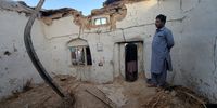epa09512477 A local resident stands beside his damaged house, after a 5.9 magnitude earthquake with a shallow depth of 9km struck in Harnai, Balochistan province, Pakistan, 08 October 2021. At least 23 people died and several houses collapsed in the quake, fearing more casualities, according to the Provincial Disaster Management Authority (PDMA).  EPA-EFE/JAMAL TARAQAI