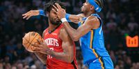 Shai Gilgeous-Alexander #2 of the Oklahoma City Thunder guards Tari Eason #17 of the Houston Rockets during the first half at Paycom Center on October 21, 2025 in Oklahoma City, Oklahoma. NOTE TO USER: User expressly acknowledges and agrees that, by downloading and or using this photograph, User is consenting to the terms and conditions of the Getty Images License Agreement.(Photo: William Purnell/Getty Images)