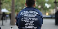 A child wears a shirt with the names of first responders killed during the 9/11 terror attack during the annual 9/11 Commemoration Ceremony at the National 9/11 Memorial and Museum on September 11, 2025 in New York City. Local and national government officials joined family, friends, and first responders as they gathered at Ground Zero honoring the lives of their loved ones on the 24th anniversary of the terror attacks of September 11, 2001, at the World Trade Center.  (Photo by Michael M. Santiago/Getty Images)