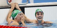 epaselect epa09378132 Tatjana Schoenmaker of South Africa (L)  reacts after her World Record time in the Women's 200m Breastroke Final as Kaylene Corbett of South Africa (R) looks on during the Swimming events of the Tokyo 2020 Olympic Games at the Tokyo Aquatics Centre in Tokyo, Japan, 30 July 2021.  EPA-EFE/HOW HWEE YOUNG