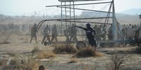 Moments before the south african police services members fire live ammunition at mine workers , mine workers demonstrate as they protest over wage demands outside the Nkageng informal settlement on August 16, 2012 in North West, South Africa. At least 10 people have died since the workers embarked on an illegal strike at Lonmins Marikana Platinum Mine, with the dispute heightened by conflicts between members of the National Union of Mineworkers (NUM) and the newly formed newly formed Association of Mineworkers and Construction Union. The conflict escalated later in the day when police opened fire on protesting miners killing at least 30 people.  (Photo :Felix Dlangamandla)