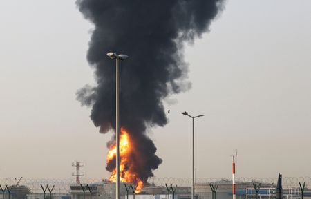 Dubai airport resumes some flights after drone attack caused fuel tank blaze