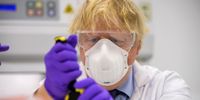 EDINBURGH, SCOTLAND - JANUARY 28: Boris Johnson tries his hand at one of the tests with Kerri Symington , quality control technician (not pictured) as he visits the French biotechnology laboratory Valneva in Livingston where they will be producing a Covid 19 vaccine on a large scale on January 28, 2021 in Livingston, Edinburgh, United Kingdom. Boris Johnson visits frontline keyworkers stating that there are great benefits of co-operating across the whole of the UK to beat the coronavirus pandemic.  Opinion polls in Scotland show rising support for independence ahead of May's Holyrood elections.  (Photo by Wattie Cheung-WPA Pool/Getty Images)