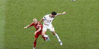  Aaron Ramsey (L) of Wales in action against Saeid Ezatolahi of Iran during the FIFA World Cup 2022 group B soccer match between Wales and Iran at Ahmad bin Ali Stadium in Doha, Qatar, 25 November 2022.  (Photo: EPA-EFE/Rungroj Yongrit)