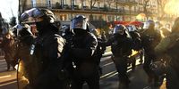 The police march towards the black bloc protesters who take part in the demonstration against the government's reform of the pension system in Paris, France, 07 February 2023. The French government plans to raise the minimum retirement age from 62 to 64 by 2030.  EPA-EFE/TERESA SUAREZ