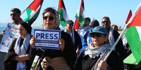 Protesters at the march along Sea Point Promenade on Sunday, 17 August, carried signs bearing the names of journalists who have been killed in Gaza since 7 October 2023. (Photo: Tamsin Metelerkamp)