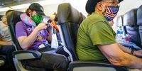 SAN DIEGO, CA - MAY 20:  Passengers onboard an American Airlines flight to Charlotte, NC at San Diego International Airport on May 20, 2020 in San Diego, California. Air travel is down as estimated 94 percent due to the coronavirus (COVID-19) pandemic, causing U.S. airlines to take a major financial hit with losses of $350 million to $400 million a day and nearly half of major carriers airplanes are sitting idle. (Photo by Sandy Huffaker/Getty Images)