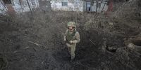 An Ukranian serviceman shows a shell hole after shelling in the Zaytseve village not far from pro-Russian militants controlled city of Gorlivka Donetsk area, Ukraine, 21 February 2022 (made available 22 February). Russia on 21 February 2022 recognized the eastern Ukrainian self-proclaimed breakaway regions as independent states and ordered the deployment of peacekeeping troops to the Donbas, triggering an expected series of economic sanctions announcements by Western countries. The self-proclaimed Donetsk People's Republic (DNR) and Luhansk People's Republic (LNR) declared independence in 2014 amid an armed conflict in eastern Ukraine.  (Photo: EPA-EFE/ALISA YAKUBOVYCH)