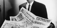 Portrait of human rights activist Malcolm X reading stories about himself in a pile of newspapers, circa 1963. (Photo by Three Lions/Hulton Archive/Getty Images)