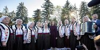 President of Moldova Maia Sandu (C), candidate in the presidential elections, poses with traditional singers at an electoral meeting in Telenesti, 92 km north from Chisinau, Moldova, 18 October 2024. Moldova will hold presidential elections on 20 October 2024.  EPA-EFE/DUMITRU DORU