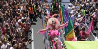 People attend the Gay Pride Parade in Tel Aviv, Israel, 10 June 2022. Tens of thousands of people took part at the annual Tel Aviv Pride Parade supporting the LGBTI (lesbian, gay, bisexual, transgender, and intersex) community.  EPA-EFE/ABIR SULTAN