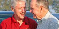 Former US presidents George H. W. Bush (R) and Bill Clinton (L) talk as they board a private plane to depart for Indonesia's tsunami-ravaged Aceh province following a visit to Phuket, at Phuket International airport, Thailand, 20 February 2005 (reissued 01 December 2018).  EPA-EFE/VINAI DITHAJOHN