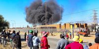 Onlookers at the fire at the Zola substation on 12 June 2024. (Photo:  Gallo Images / Fani Mahuntsi)
