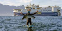 Ocean activist Flo Jung from Germany protests against oil giant Shell and the Shearwater seismic vessel Amazon Warrior as it arrives in Cape Town, South Africa, on 21 November 2021. (Photo: EPA-EFE / Nic Bothma)