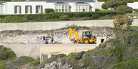 A digger loader excavates on Markus Jooste's Kwaaiwater stand on February 21, 2022 in Hermanus, South Africa. (Photo by Gallo Images/Misha Jordaan)