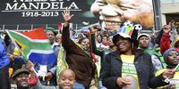 South Africans cheering during a speech about the life of late South African President Nelson Mandela during the official memorial ceremony for late South African president Nelson Mandela at FNB Stadium in Johannesburg, South Africa, on 10 December 2013. Nobel Peace Prize winner Nelson Mandela died on 05 December at the age of 95. (Photo: EPA/Antonio Silva)