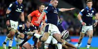 LONDON, ENGLAND - FEBRUARY 04: Finn Russell of Scotland kicks the ball upfield during the Six Nations Rugby match between England and Scotland at Twickenham Stadium on February 04, 2023 in London, England. (Photo by David Rogers/Getty Images)